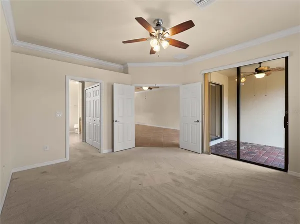 an empty room with fan and a ceiling fan