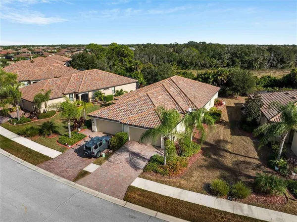an aerial view of a house with a garden