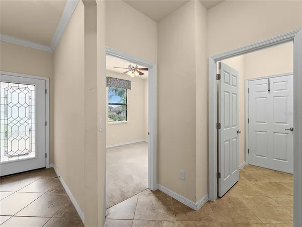 an empty room with windows and closet