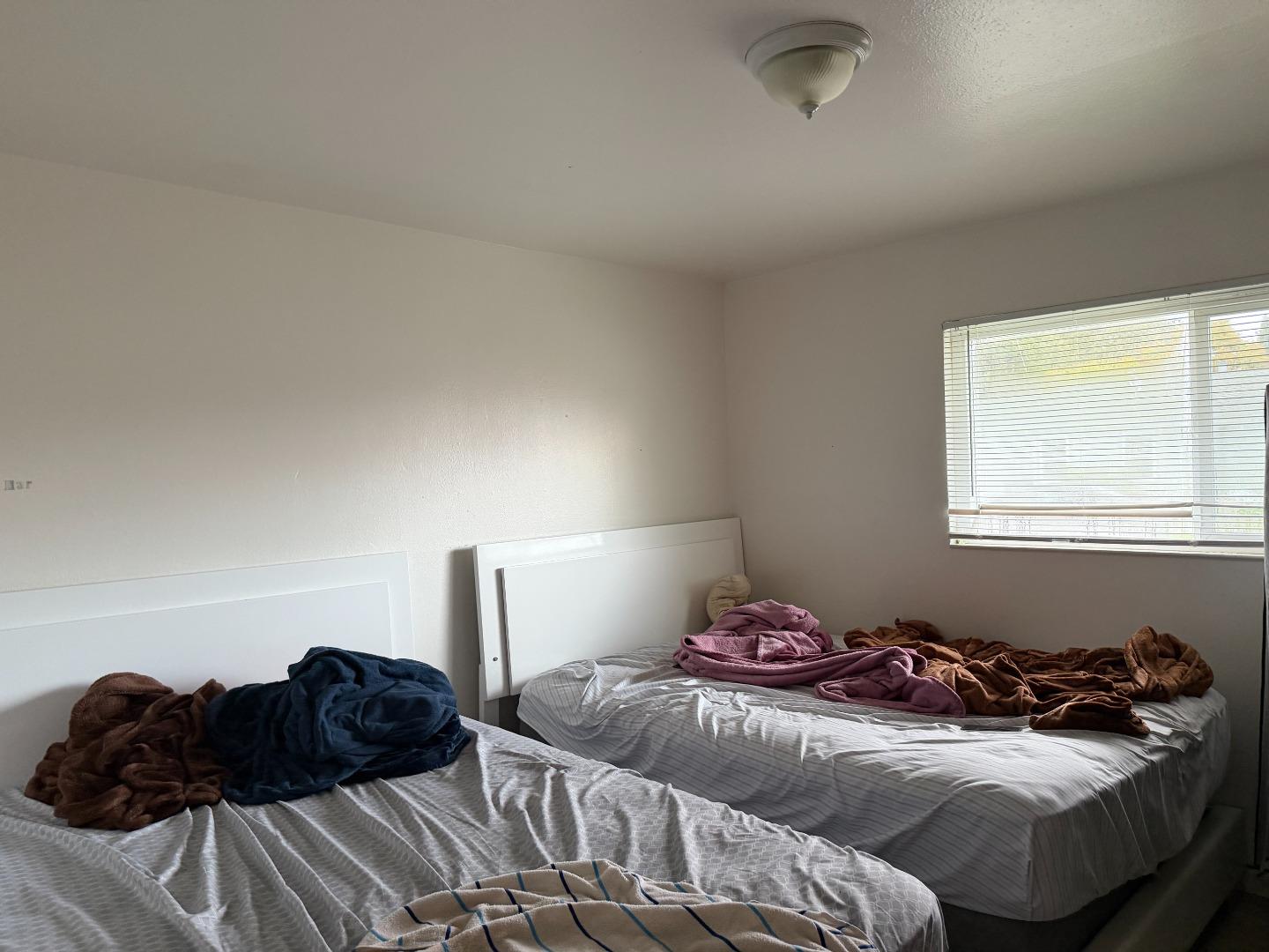 1704 Dutton Avenue Santa Rosa, CA 95407 - Photo 5 of 10 a bedroom with a bed and a window