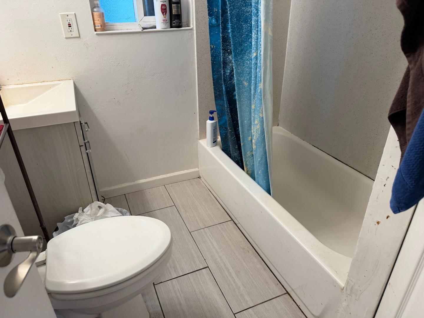 1704 Dutton Avenue Santa Rosa, CA 95407 - Photo 8 of 10 a bathroom with a sink and toilet