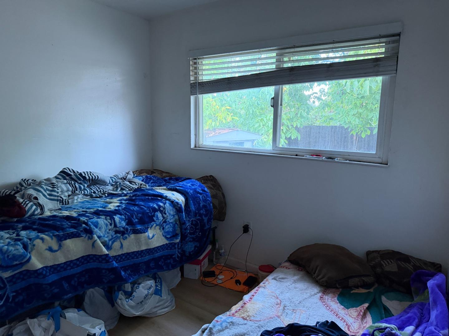 1704 Dutton Avenue Santa Rosa, CA 95407 - Photo 9 of 10 a bedroom with a bed and a window