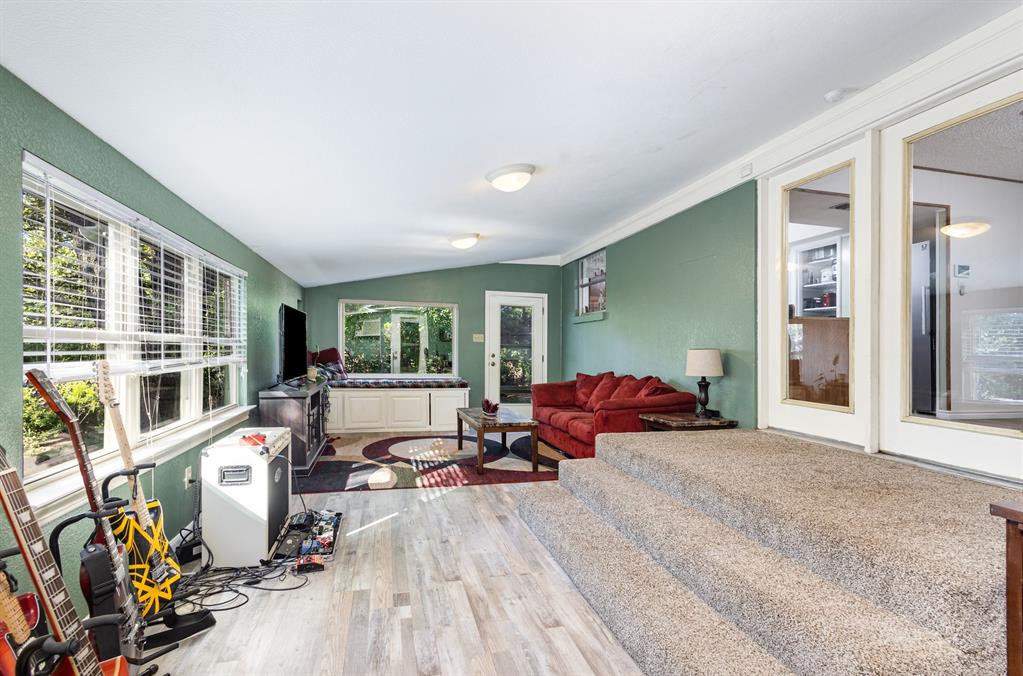 808 Ravenwood Drive Arlington, TX 76013 - Photo 11 of 27 a living room with furniture and a large window