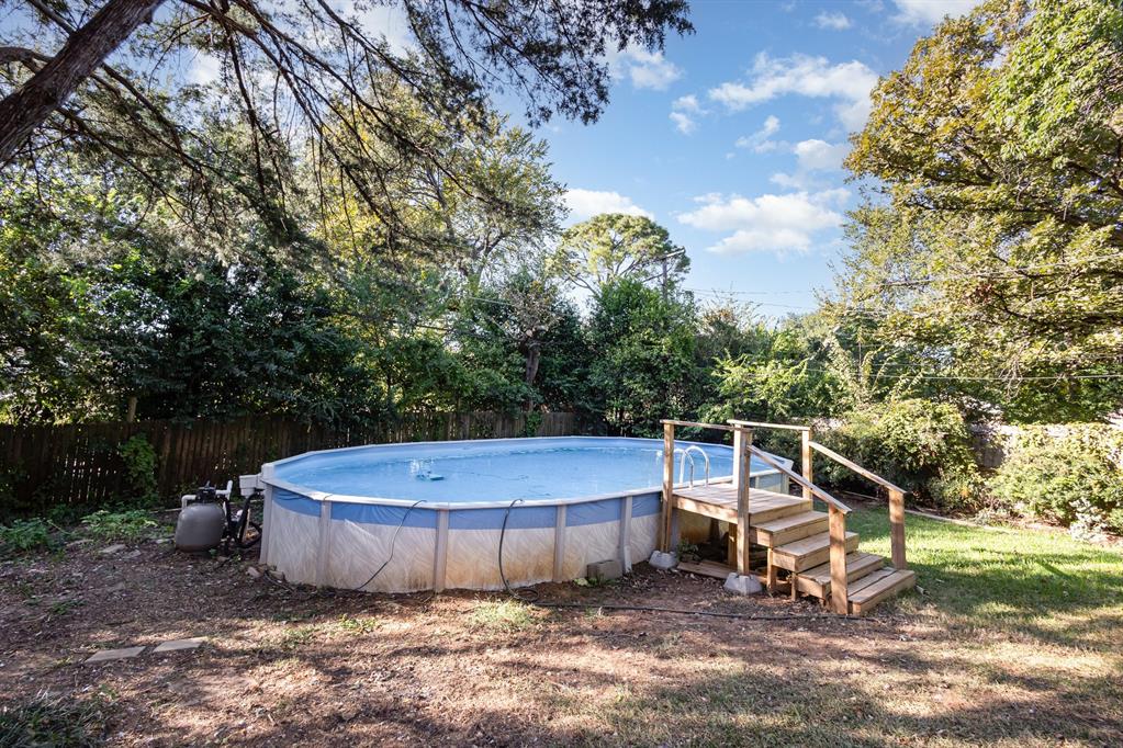 808 Ravenwood Drive Arlington, TX 76013 - Photo 24 of 27 a view of a tiny house with yard and sitting area