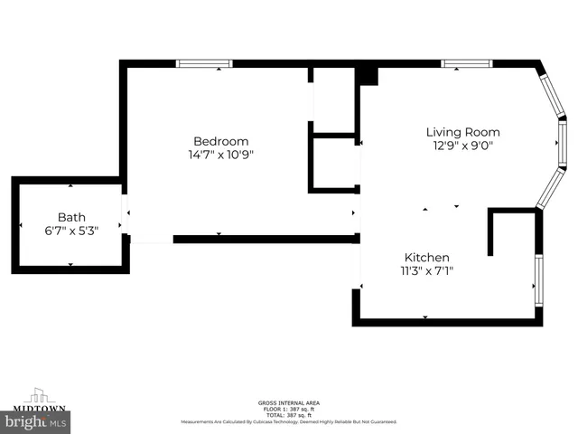 a front view of a residential apartment building with a yard