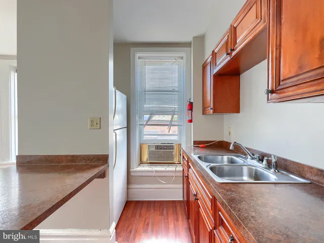a kitchen with stainless steel appliances granite countertop a stove and a sink