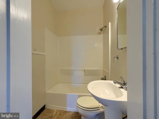 a kitchen that has a sink and a stove