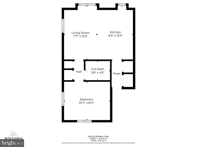 a view of room with window and wooden floor