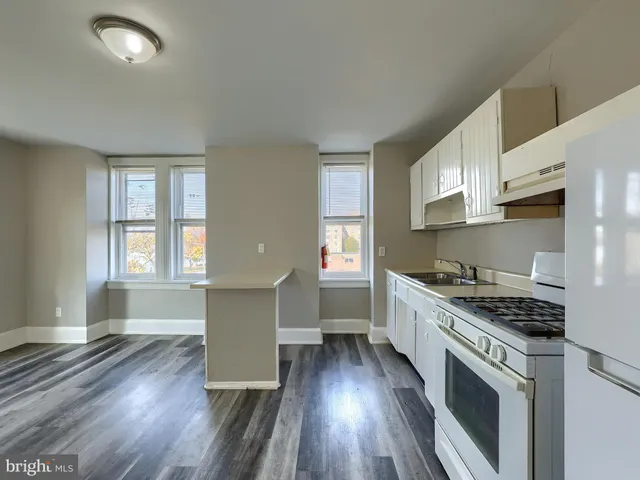 a picture of a bench in a white building