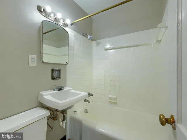 a kitchen with a stove and a white refrigerator