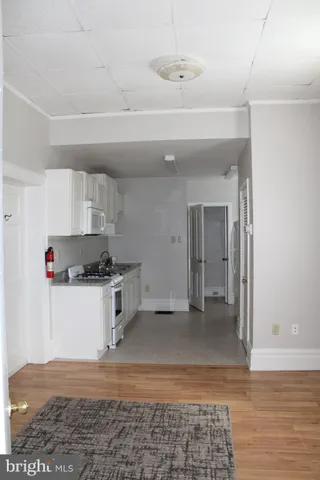 a kitchen with a stove cabinets and a counter top space