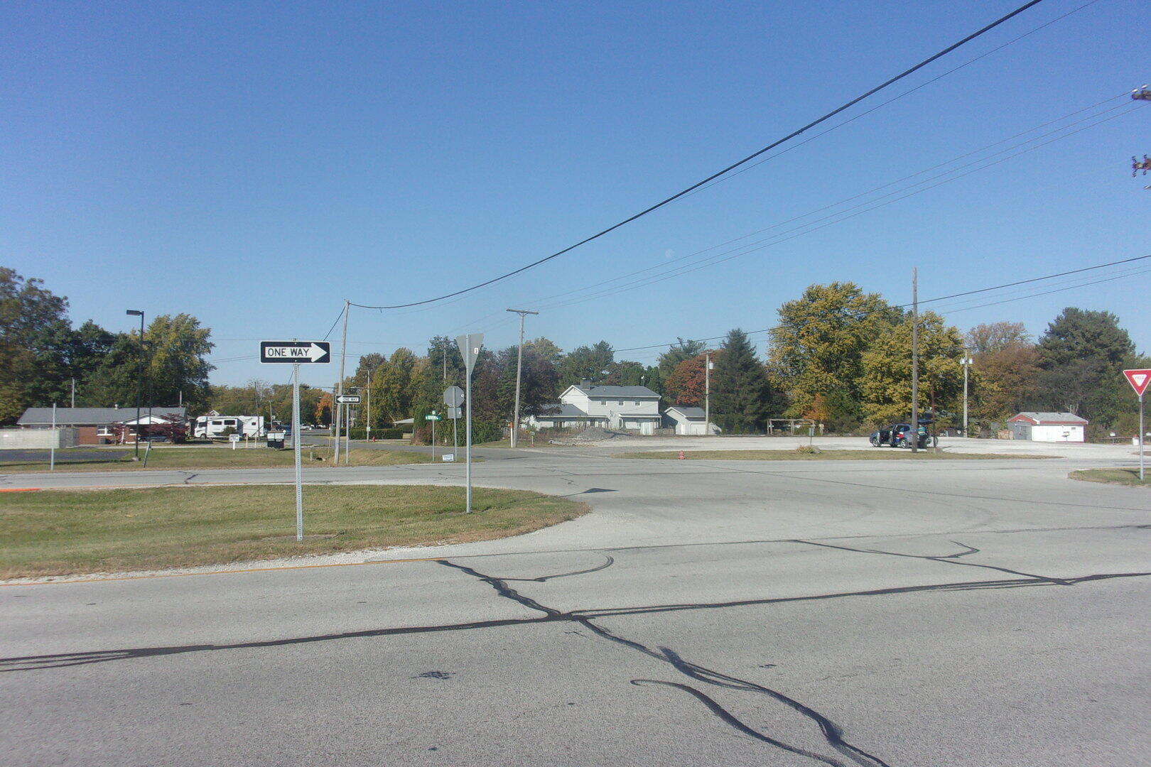 407 North 7th Street Kentland, IN 47951 - Photo 4 of 5 a view of a house with a big yard and a large tree