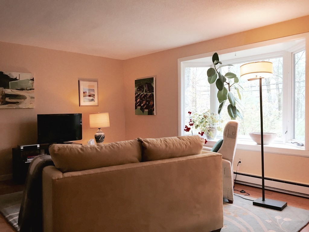 14 Gulf Road Pelham, MA 01002 - Photo 12 of 30 a living room with furniture a flat screen tv and a window