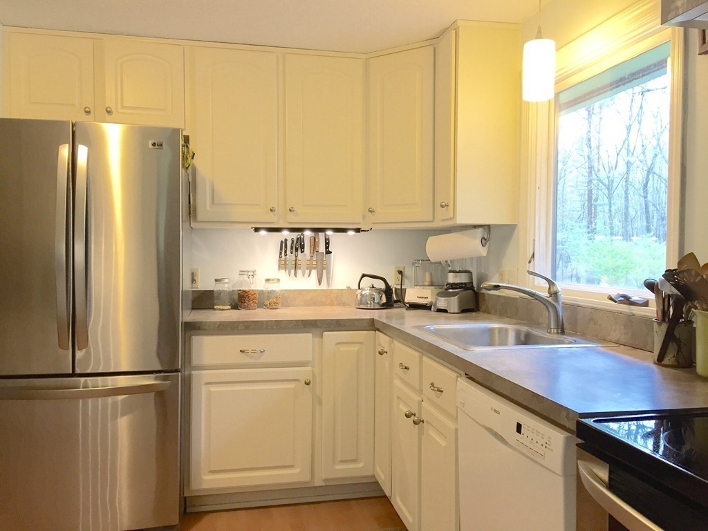 14 Gulf Road Pelham, MA 01002 - Photo 3 of 30 a kitchen with a refrigerator sink and cabinets