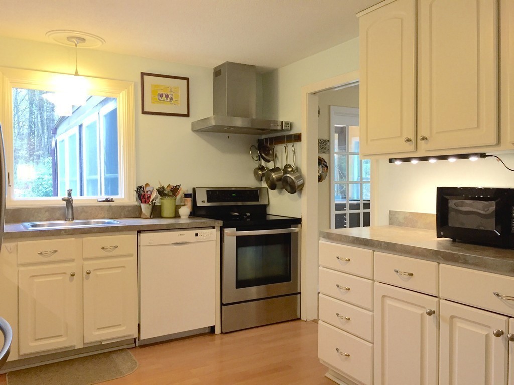 14 Gulf Road Pelham, MA 01002 - Photo 4 of 30 a kitchen with white cabinets and sink