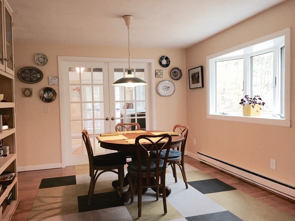 14 Gulf Road Pelham, MA 01002 - Photo 7 of 30 a view of a dining room with furniture and chandelier