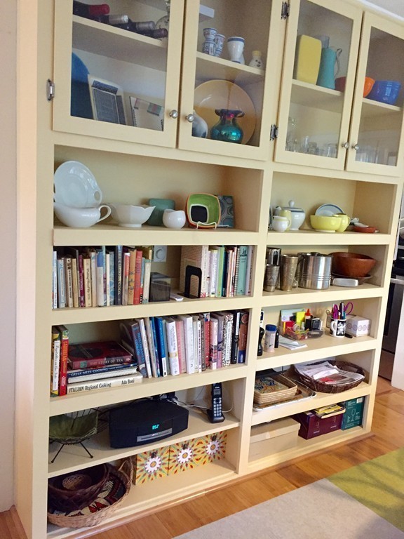 14 Gulf Road Pelham, MA 01002 - Photo 8 of 30 a shelf with books and knick knacks on it