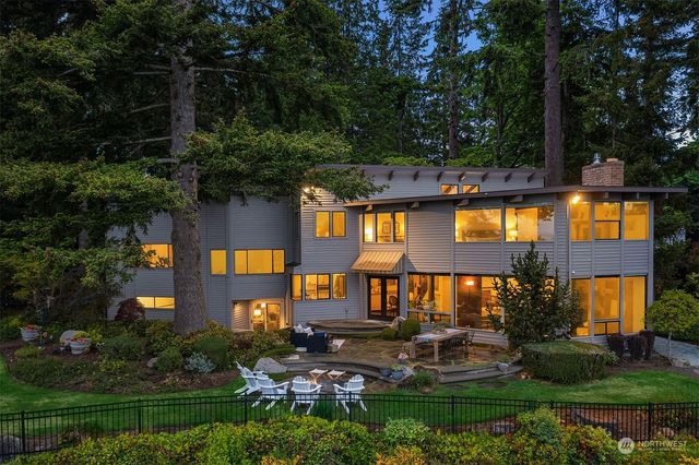 a view of swimming pool with outdoor seating and yard