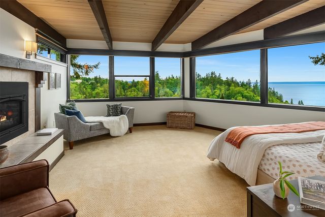 a bedroom with furniture and a fireplace