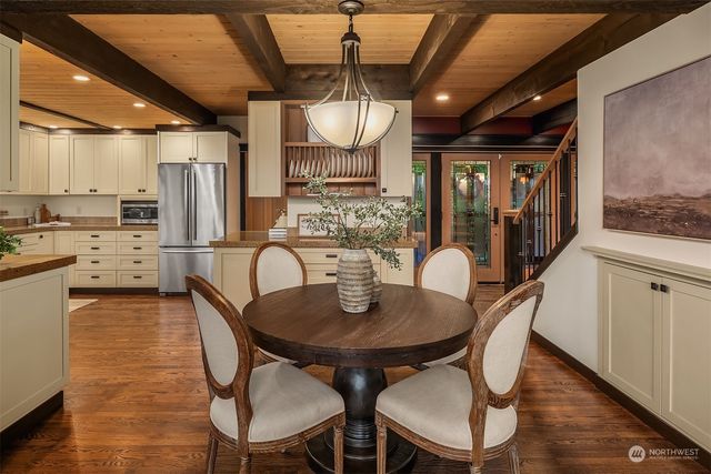 a dining room with furniture and window