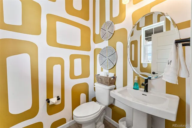 a bedroom with a bed and a refrigerator