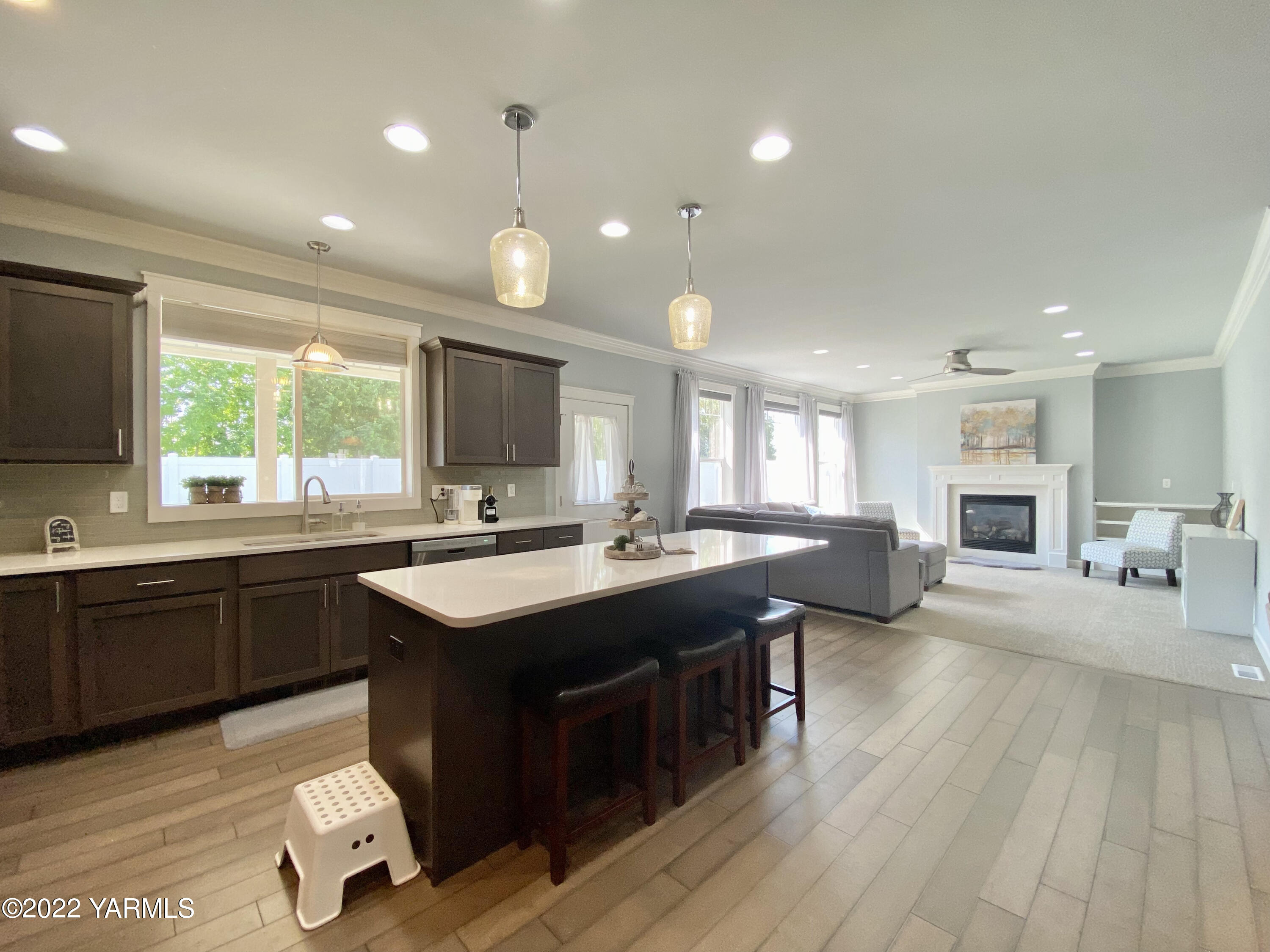 2110 Ruby Way Yakima, WA 98903 - Photo 17 of 36 a kitchen with counter top space sink stove and wooden floor