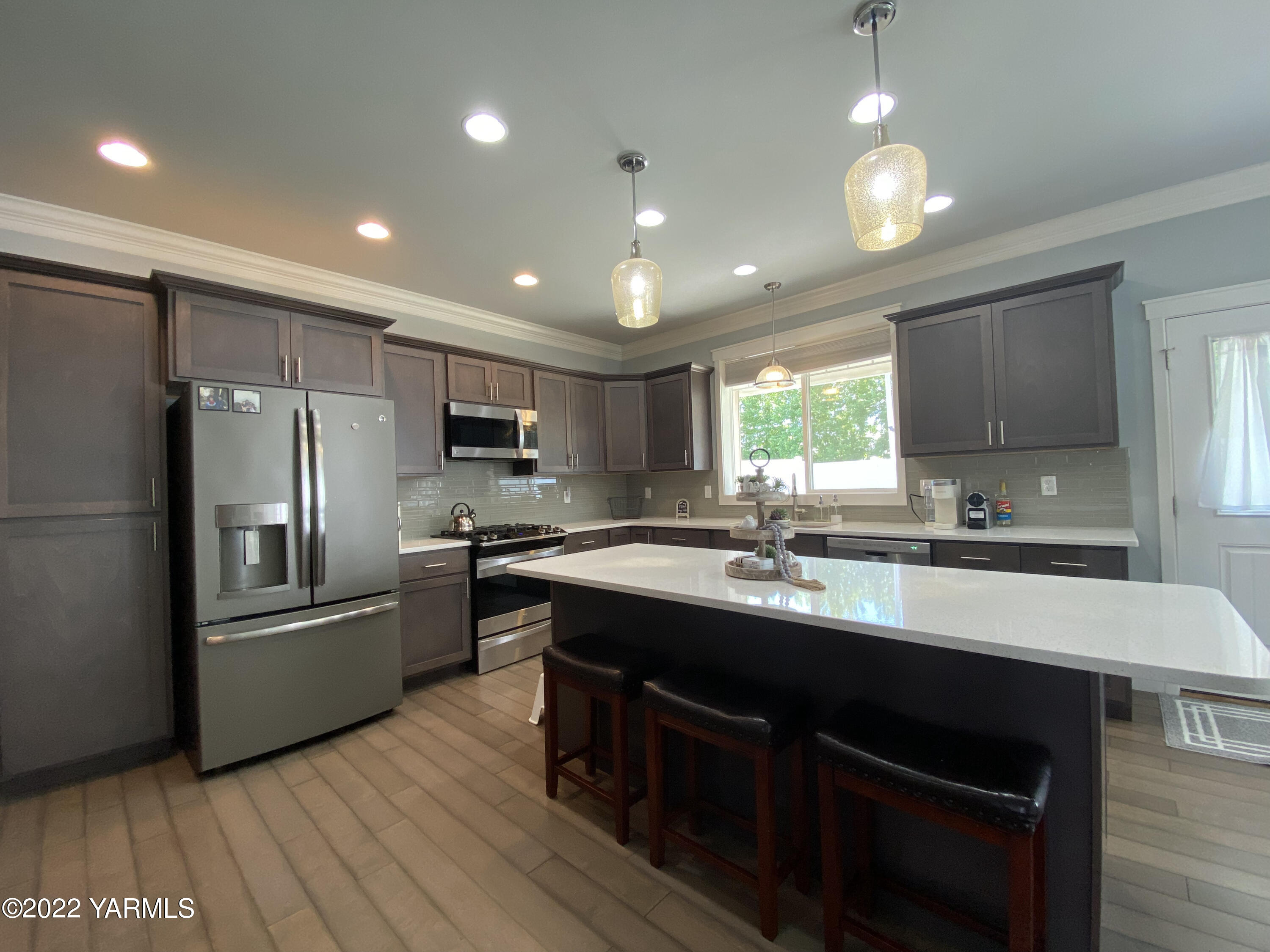 2110 Ruby Way Yakima, WA 98903 - Photo 20 of 36 a kitchen with counter top space cabinets and stainless steel appliances