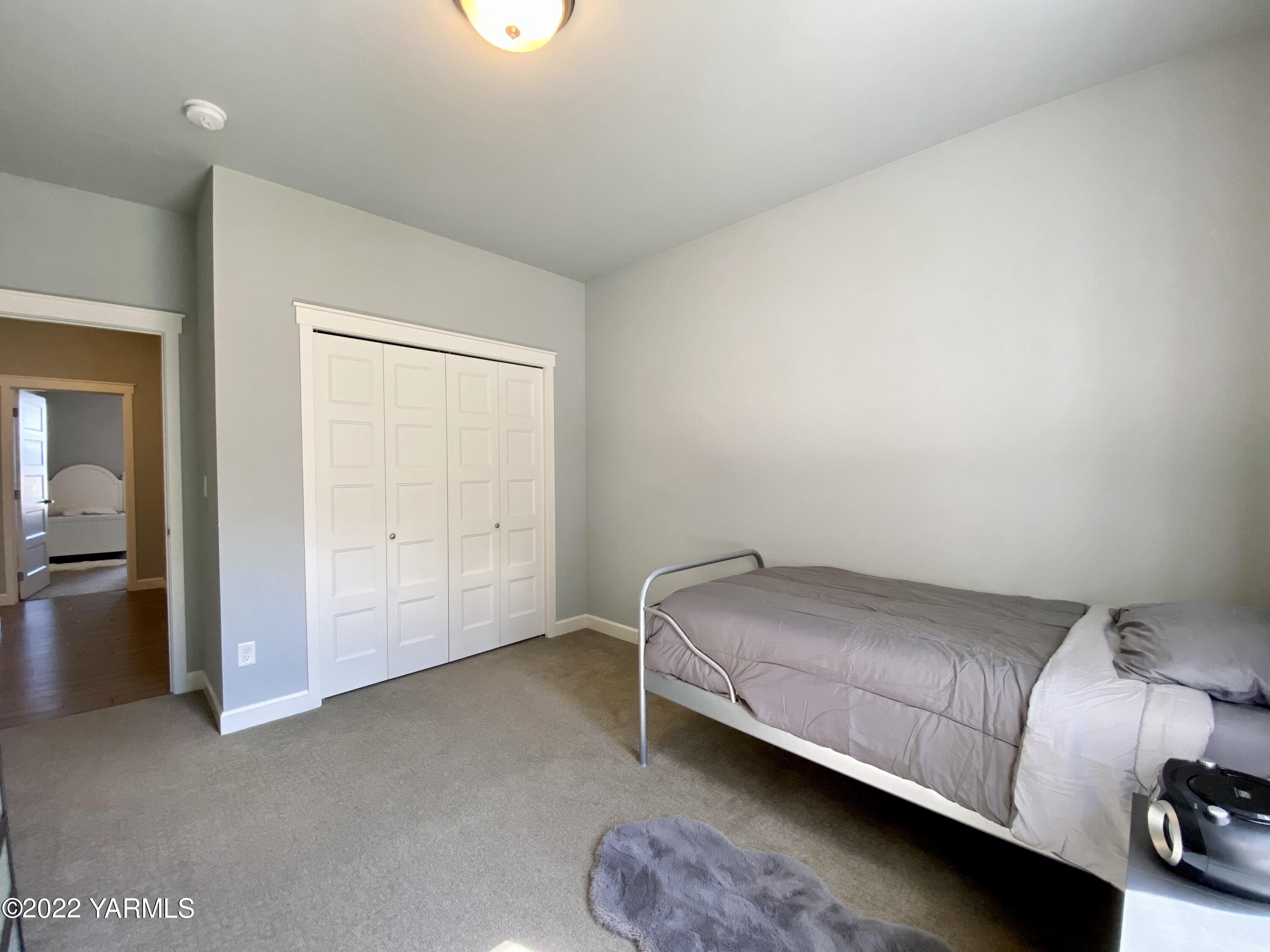 2110 Ruby Way Yakima, WA 98903 - Photo 28 of 36 a room with a bed and a night stand