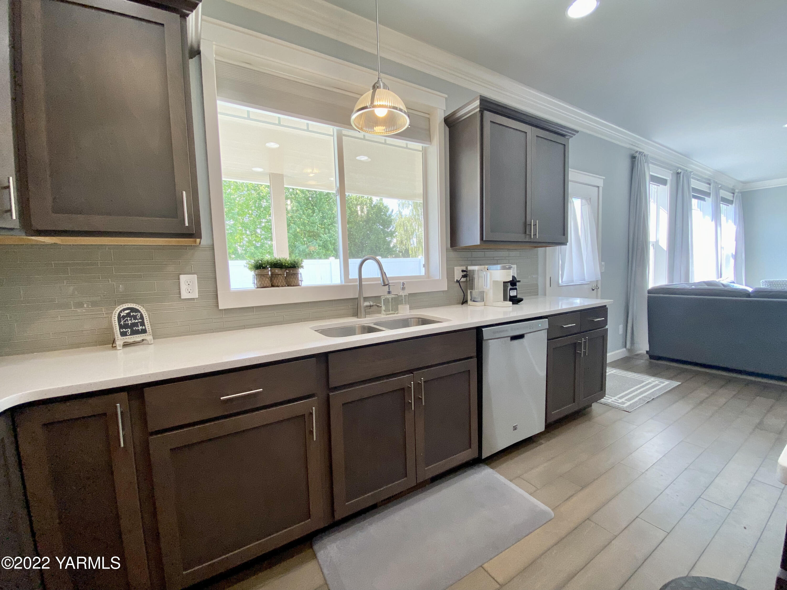 2110 Ruby Way Yakima, WA 98903 - Photo 7 of 36 a kitchen with a sink window and cabinets