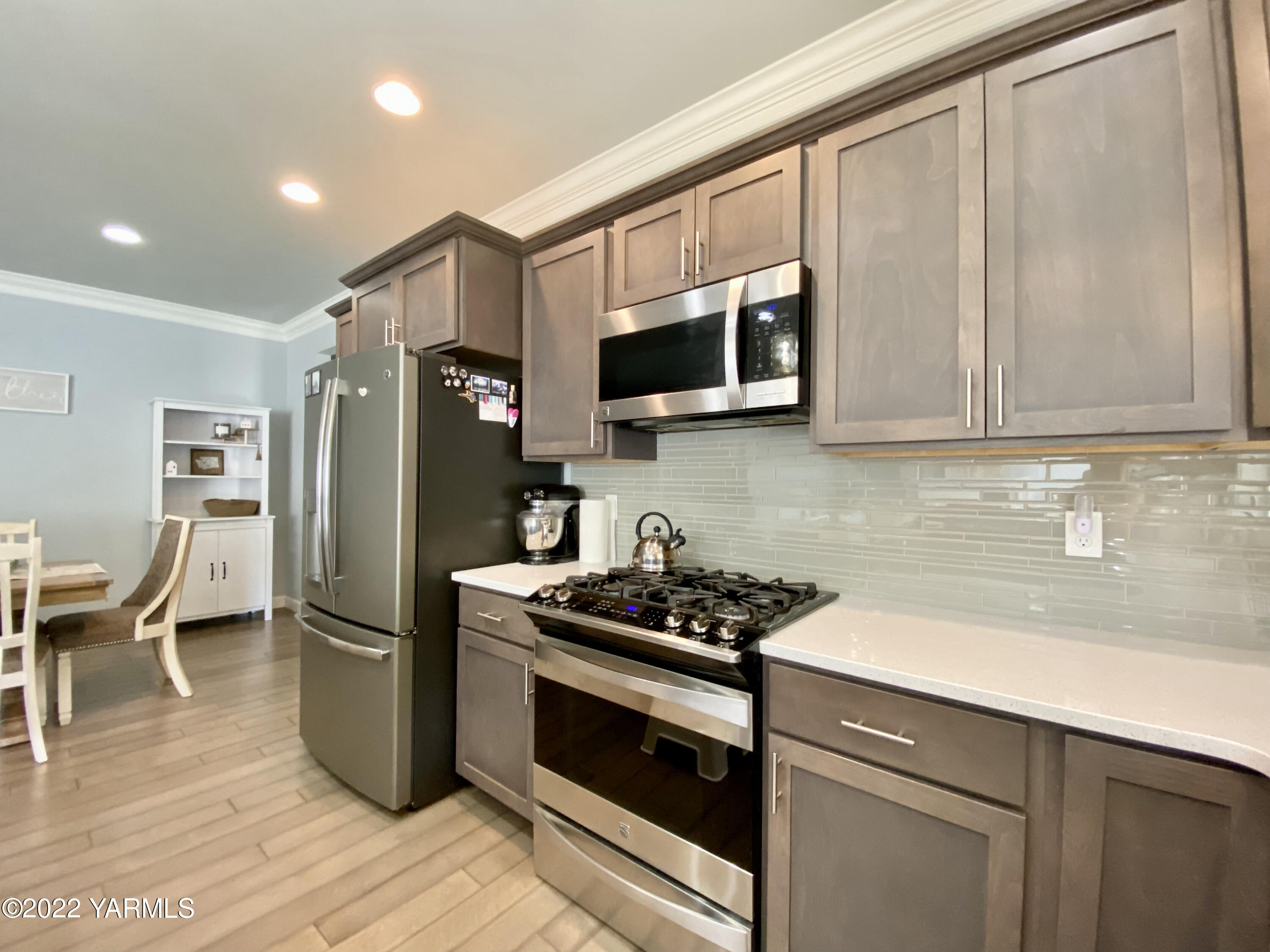 2110 Ruby Way Yakima, WA 98903 - Photo 8 of 36 a kitchen with stainless steel appliances granite countertop a refrigerator stove and microwave