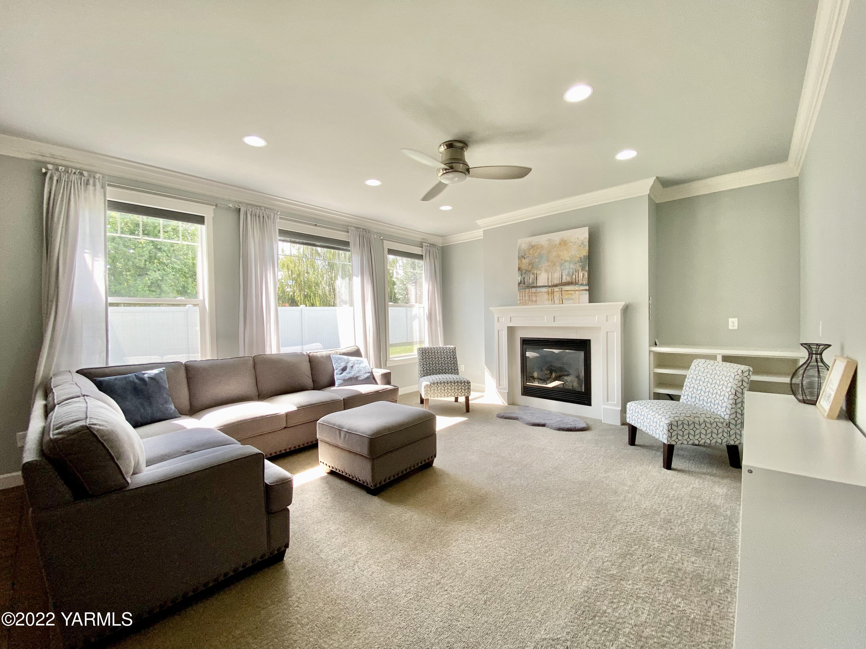 2110 Ruby Way Yakima, WA 98903 - Photo 9 of 36 a living room with furniture and a fireplace