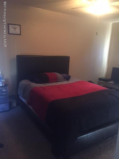 4223 South Washington Street Amarillo, TX 79110 - Photo 3 of 15 a bedroom with a bed and a window