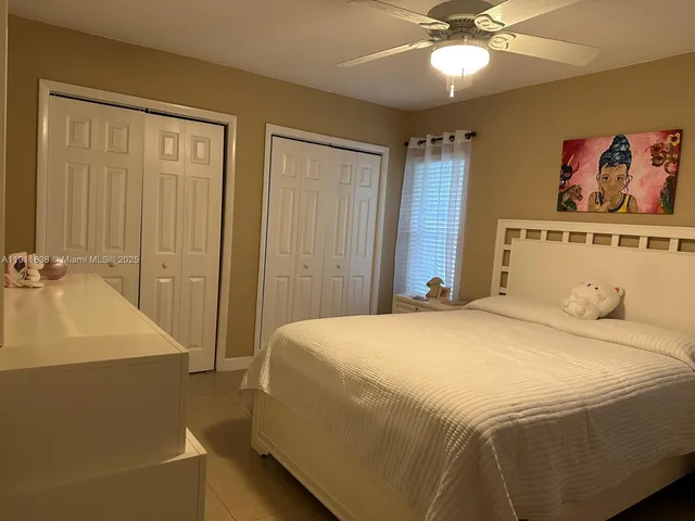a bedroom with a bed and a table
