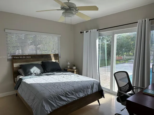 a room with gym equipment and a large window