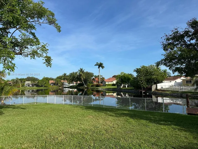 a view of a house with backyard sitting area and porch