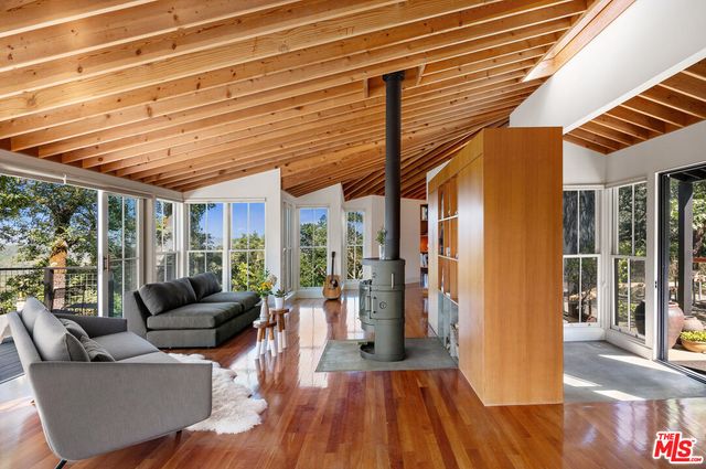 a dining hall with a dining table and chairs