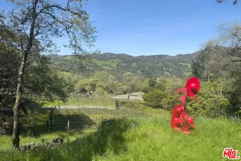 a view of a houses with a yard