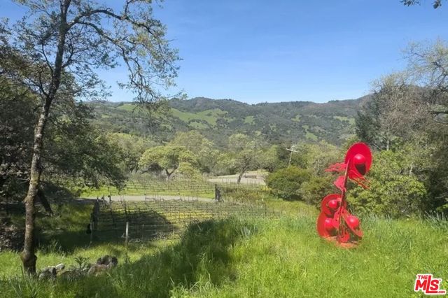 a view of a houses with a yard