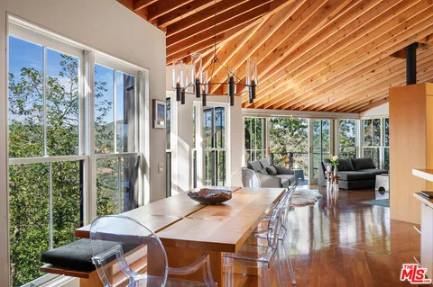 a stove top oven sitting inside of a kitchen