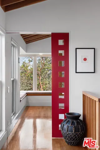 a bedroom with furniture and a window