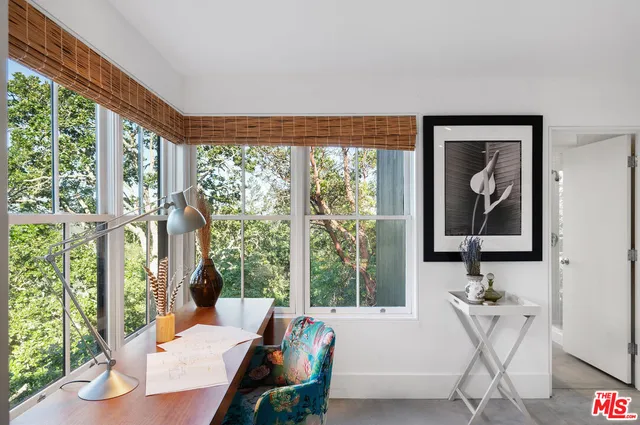 a view of balcony with wooden floor and fence