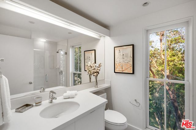 a view of a city with lush green forest