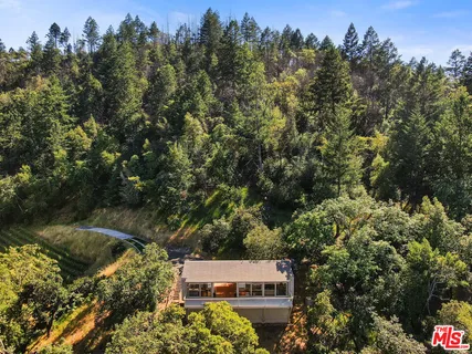 swimming pool view with a seating space