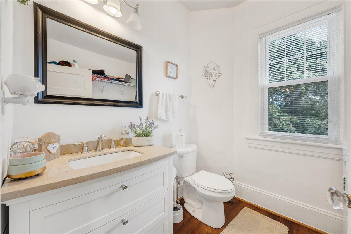 528 Riverland Road Southeast Roanoke, VA 24014 - Photo 11 of 42 a bathroom with a granite countertop sink mirror vanity and toilet