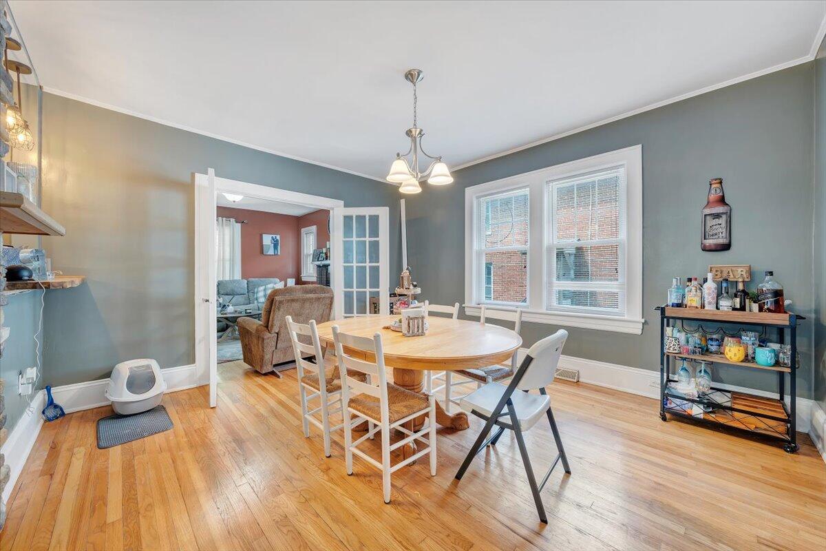 528 Riverland Road Southeast Roanoke, VA 24014 - Photo 13 of 42 a view of a dining room with furniture window and wooden floor