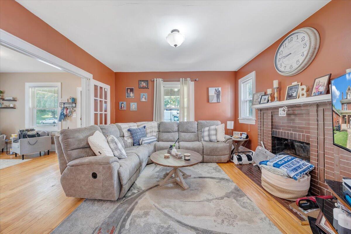 528 Riverland Road Southeast Roanoke, VA 24014 - Photo 17 of 42 a living room with furniture a large window and a fireplace