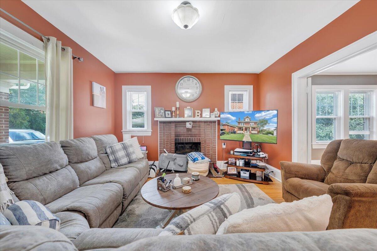 528 Riverland Road Southeast Roanoke, VA 24014 - Photo 19 of 42 a living room with furniture fireplace and a large window