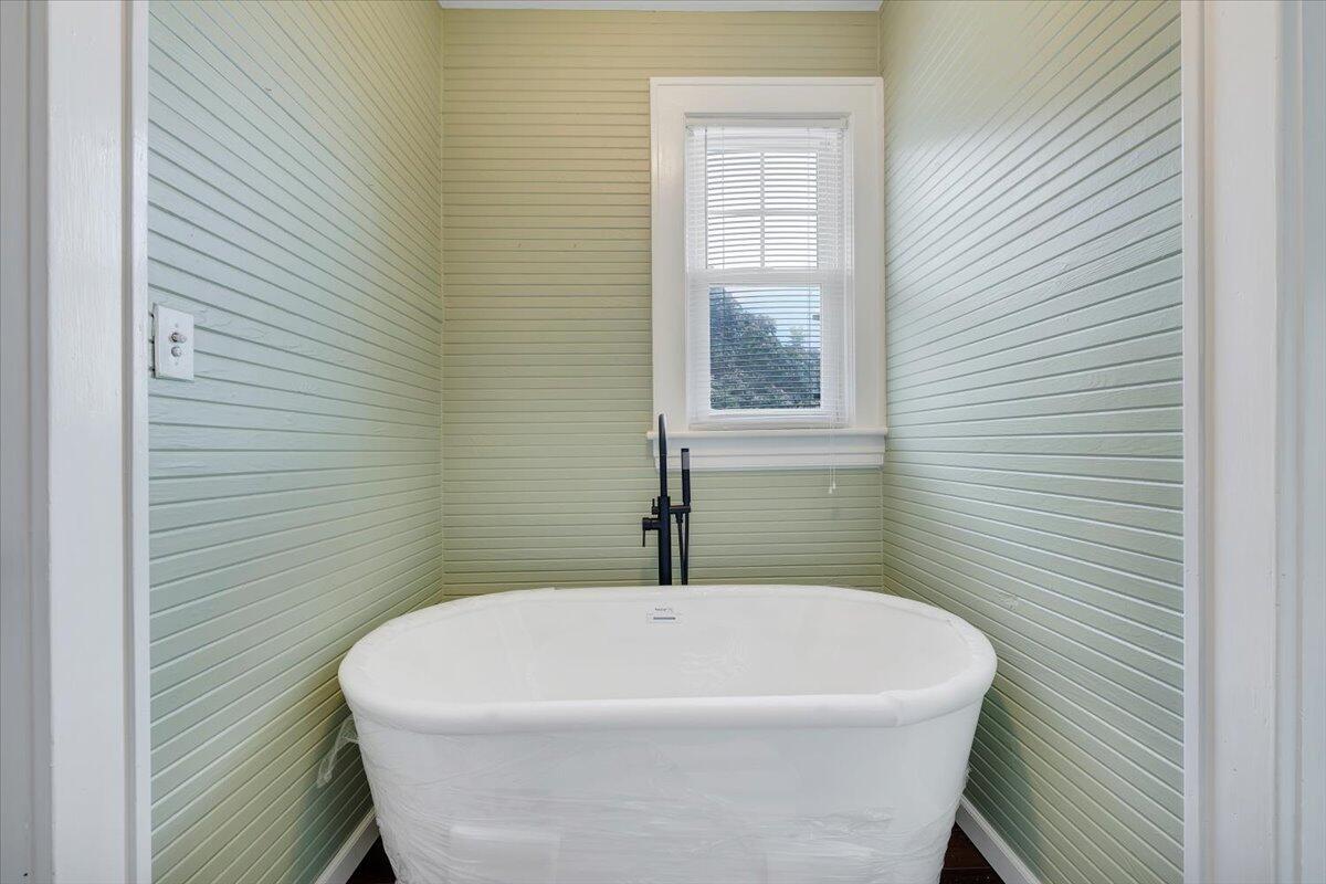 528 Riverland Road Southeast Roanoke, VA 24014 - Photo 30 of 42 a white bath tub sitting in a bathroom