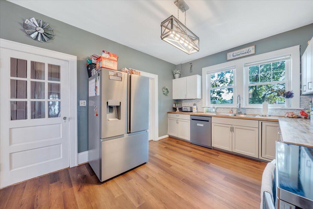 528 Riverland Road Southeast Roanoke, VA 24014 - Photo 6 of 42 a kitchen with stainless steel appliances a refrigerator sink and cabinets