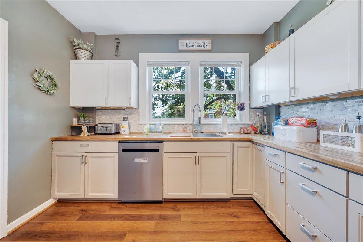 528 Riverland Road Southeast Roanoke, VA 24014 - Photo 8 of 42 a kitchen with stainless steel appliances granite countertop a sink a stove a refrigerator wooden floor and cabinets
